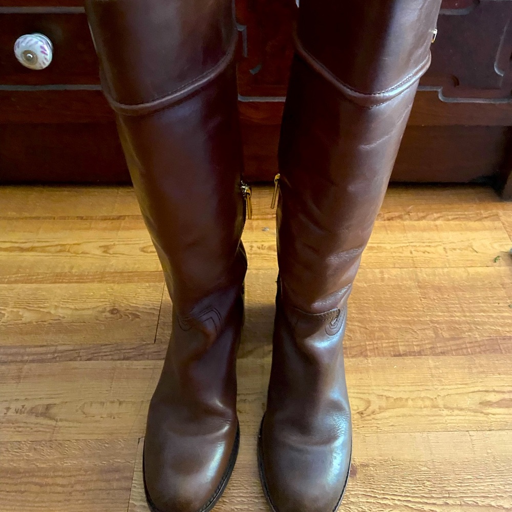 Tall brown leather Coach boots. Side zip with buckle.